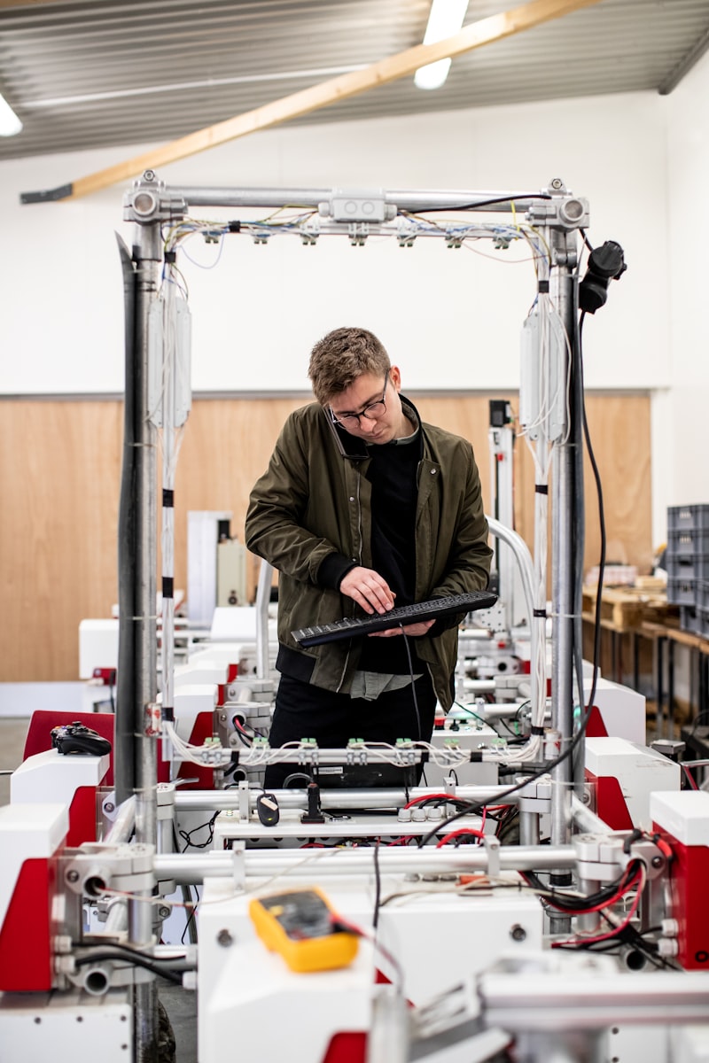 Engineer discussing project on the phone near prototype testing frame